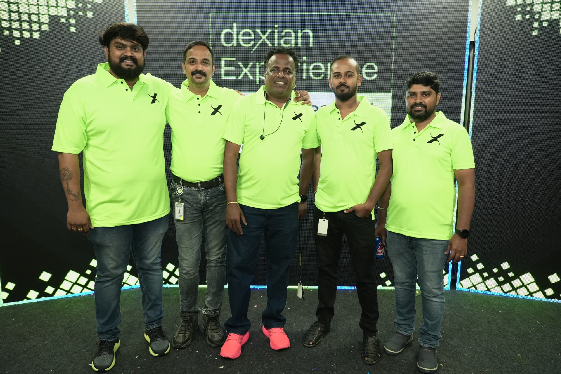 Organising team in event uniform on stage