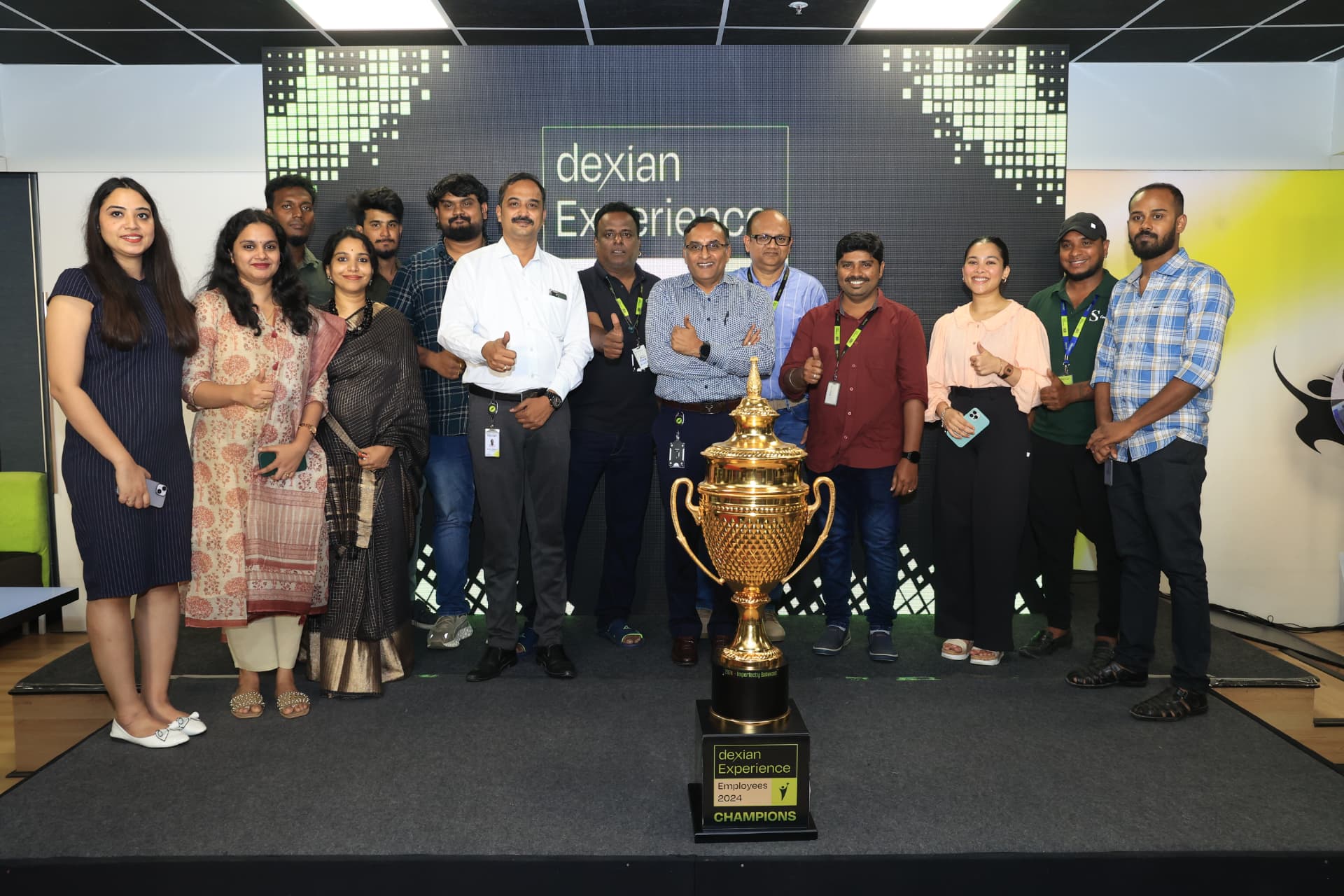 Winning team on stage with the champions trophy
